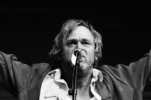 musical instrument greyscale photo of man human